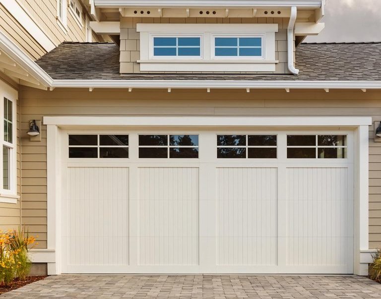 nice_house_with_white_garage_door_and_an_attic_-_garage_door_repairs_in_pensacola_-_pensacola_overhead_door_&_operator.jpg